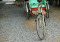 A classic rickshaw parked in the park, vinatage concept Royalty Free Stock Photo