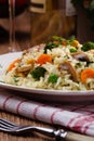 Classic Risotto with mushrooms and vegetables served on a white plate Royalty Free Stock Photo