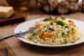 Classic Risotto with mushrooms and vegetables served on a white plate Royalty Free Stock Photo