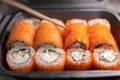 Classic rolls with salmon, rice, seaweed, cheese, crab and cucumber. Japanese food. delivery to work and home