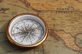 Classic round compass on old vintage map depicting North America and the United States of America Royalty Free Stock Photo