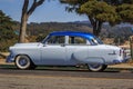 Classic 1950s Chevrolet Fleetline car in two-tone gray and blue outdoors in California