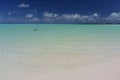 Classic Sailing Sloop Anchored at Beautiful Beach Royalty Free Stock Photo