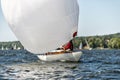 Classic sailing yacht with spinnaker on a lake in a regatta