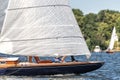 Classic sailing yacht with spinnaker on a lake in a regatta