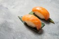 Classic Salmon Sushi on concrete background.