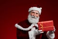 Classic Santa Holding Christmas Present Royalty Free Stock Photo