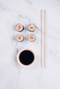 Classic sashimi with salmon or tuna fish, soy sauce and chopsticks on marble table background - maki sushi roll, nori