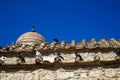 Classic scene of pigeons in white, black and grey color on terracotta roof tile of old classic little church in earth tone natural Royalty Free Stock Photo