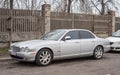 Classic sedan silver Jaguar parked