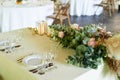 Classic serving in the restaurant, plates of glasses, and forks.Making a pampas grass and greenery. Floristics.