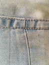 Stitched boiled jeans. Shabby vintage clothing. Macro shot. Royalty Free Stock Photo