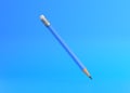 Classic sharp wooden pencil with rubber eraser flying on blue background