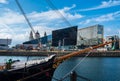 A classic ship set against the Liverpool cityscape at the Liverpool Docks, Port of Liverpool, on a beautiful summer afternoon