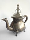 Classic silver arabic teapot isolated on white background. Close up of Old Moroccan teapot