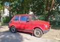 Classic small red Polish car Polski Fiat 126p dparked