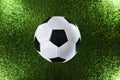 Classic soccer ball on the grass illuminated by four spotlights Royalty Free Stock Photo