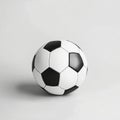 classic soccer ball showcases its iconic black and white pattern against a plain white background. The soft shadow adds Royalty Free Stock Photo