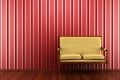 Classic sofa in front of red striped wall Royalty Free Stock Photo