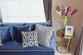 Classic sofa and retro pillows with a lovely orchid vase