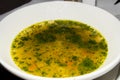 Classic Soup au pistou pesto in a white bowl being served in a restaurant. traditional authentic Royalty Free Stock Photo