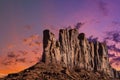 Classic southwest desert landscape under an evening sky and bright sun in Monument Valley Royalty Free Stock Photo