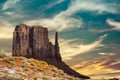 Classic southwest desert landscape under an evening sky and bright sun in Monument Valley Royalty Free Stock Photo