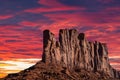 Classic southwest desert landscape under an evening sky and bright sun in Monument Valley Royalty Free Stock Photo