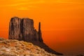 Classic southwest desert landscape under an evening sky and bright sun in Monument Valley Royalty Free Stock Photo