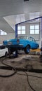 Classic soviet car in the service on car lift