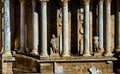 Classic statues without heads and Greek and Roman columns from the Roman Theater of Merida in Extremadura, illuminated by the