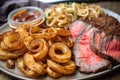 classic steak and potatoes dinner, with roasted taters and crispy onion rings