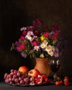 Classic still life with a bouquet of autumn flowers and ripe fruits Royalty Free Stock Photo