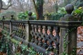 Classic stone balustrade with ivy, overgrown garden. Historical architecture Royalty Free Stock Photo