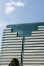 Classic Stone and Blue Glass Building Under Sunny Sky Royalty Free Stock Photo