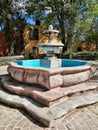 Classic stone fountain with morning light at guadiana park san miguel de allende