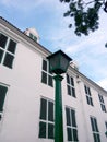 classic street lamp and the old white building