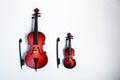 Classic stringed instruments cello and violin on white background