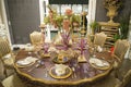 A classic style dining table and dinner set on the table