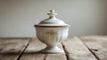 Classic sugar bowl with lid placed on a kitchen table. Royalty Free Stock Photo