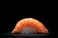 Classic sushi nigiri with salmon on a dark stone background Royalty Free Stock Photo