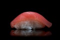 Classic sushi nigiri with tuna on a black stone