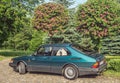 Classic old Swedish veteran vintage historic oldtimer famous metal green car Saab 900 parked Royalty Free Stock Photo