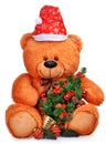 Classic teddy bear in red hat with christmas tree Royalty Free Stock Photo