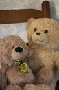 Classic Teddy Bears against a Blue Wall In a rocking chair Royalty Free Stock Photo