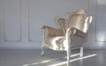 Classic fabric white armchair in white room Royalty Free Stock Photo