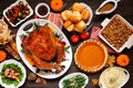 Classic Thanksgiving turkey dinner. Above view table scene on a dark wood background. Royalty Free Stock Photo