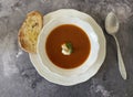 Tomato cream soup with burrata, basil and toasted ciabatta with olive oil.