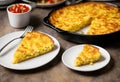 A classic tortilla de patatas, potato omelette sandwich on a slice of bread.