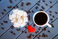 The classic traditional Turkish delight rahat -  oriental delicacy Mug with coffee, roasted grains and red heart. Wooden Royalty Free Stock Photo